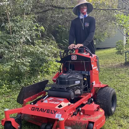 Commercial Gravely mower cutting Florida lawn
